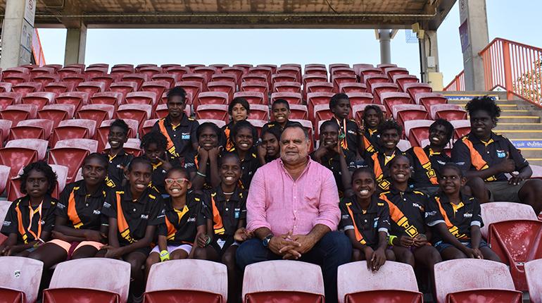 Michael Long with Elcho Eylandt and Ramingining students the day after being awarded NT Australian of the Year